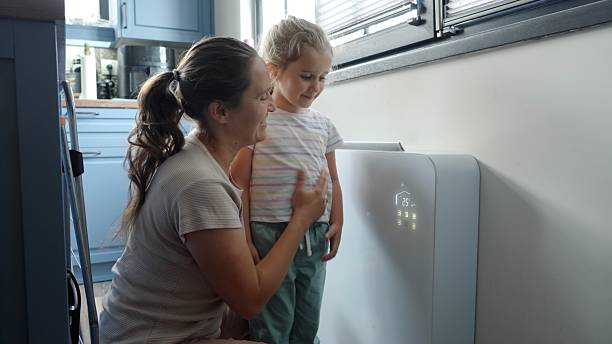radiateur électrique avec une maman et son enfant